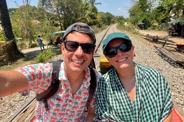 Matt and Jade take a selfie aboard the ‘Bamboo Railway’ in Cambodia, a simple petrol-powered cart on rails